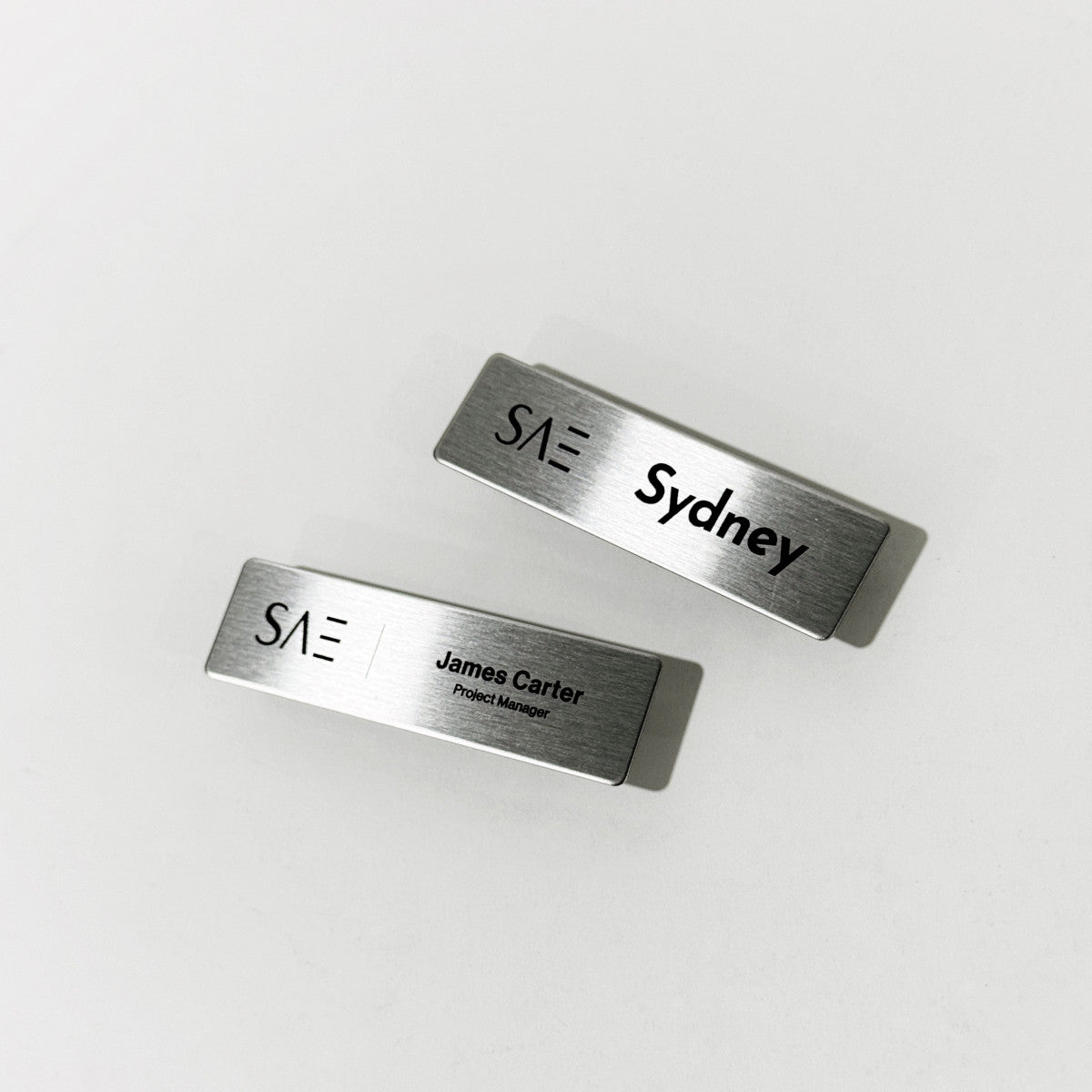 Silver stainless steel laser engraved magnetic name badge for office or retail staff