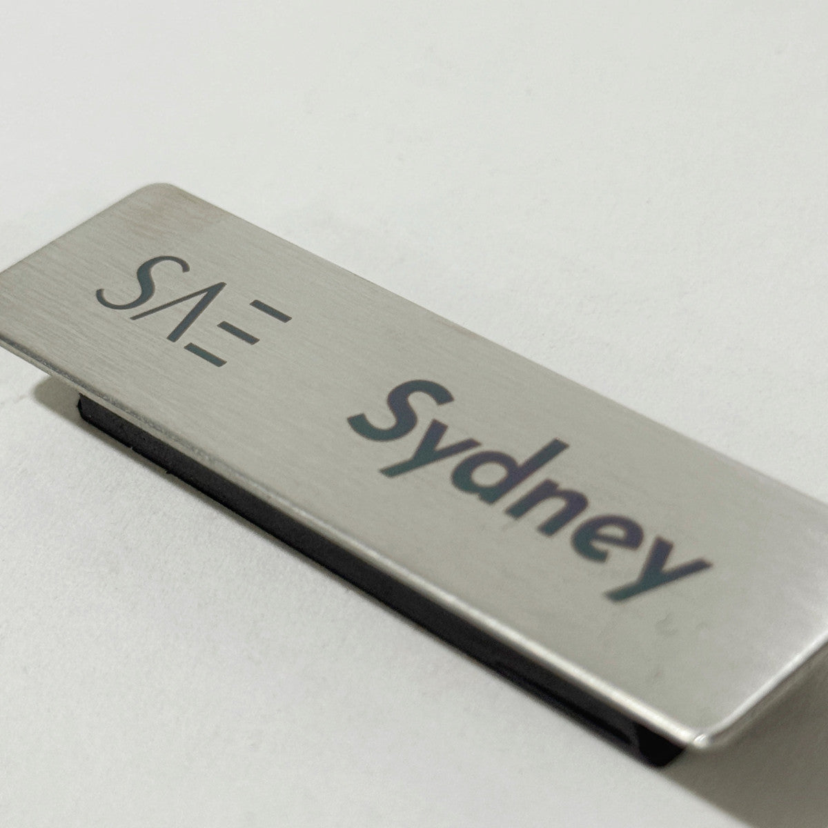 Silver stainless steel laser engraved magnetic name badge for office or retail staff