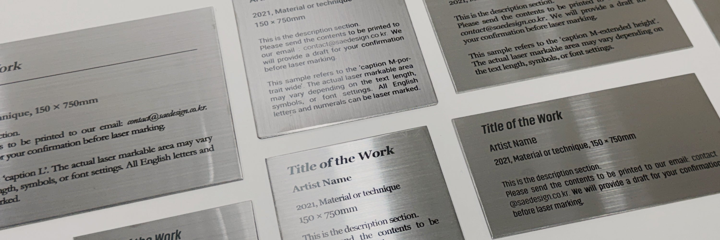 Brushed stainless steel caption plates from the SIDE Collection used to label artwork and objects