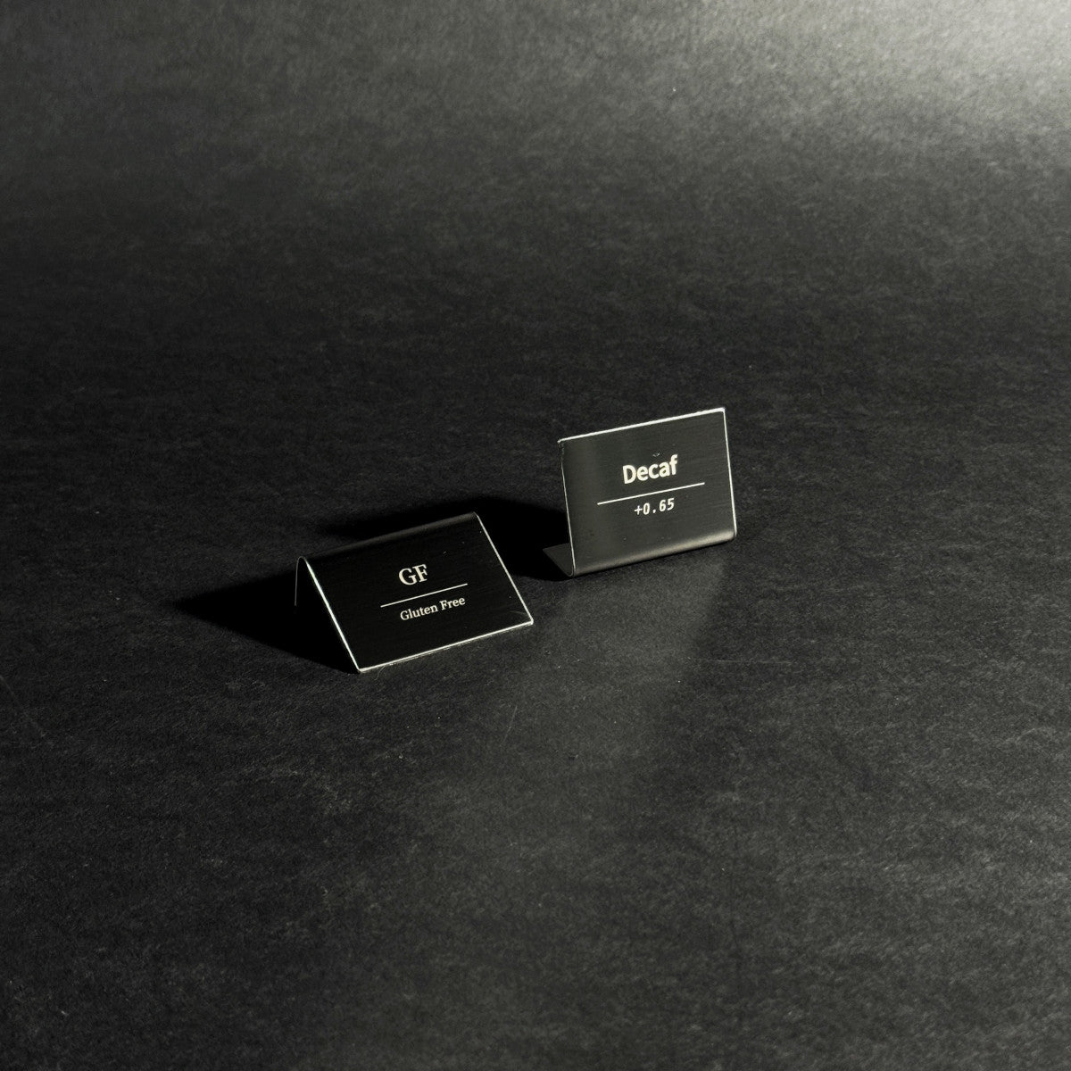 Bent Metal Laser Marked Price Tag Black 50x35mm for bakery display and cafe menu labeling
