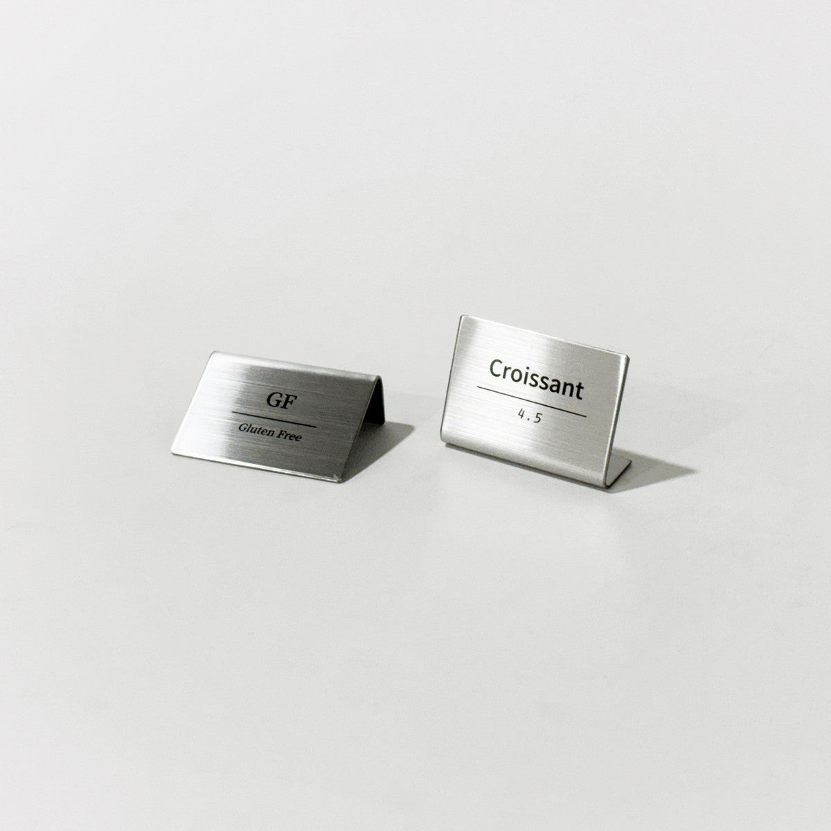 Bent Metal Laser Marked Price Tag Silver 50x35mm for bakery display and cafe menu labeling
